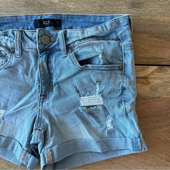 Distressed Low Rise Midi Jean Shorts w/Cuffed Hems