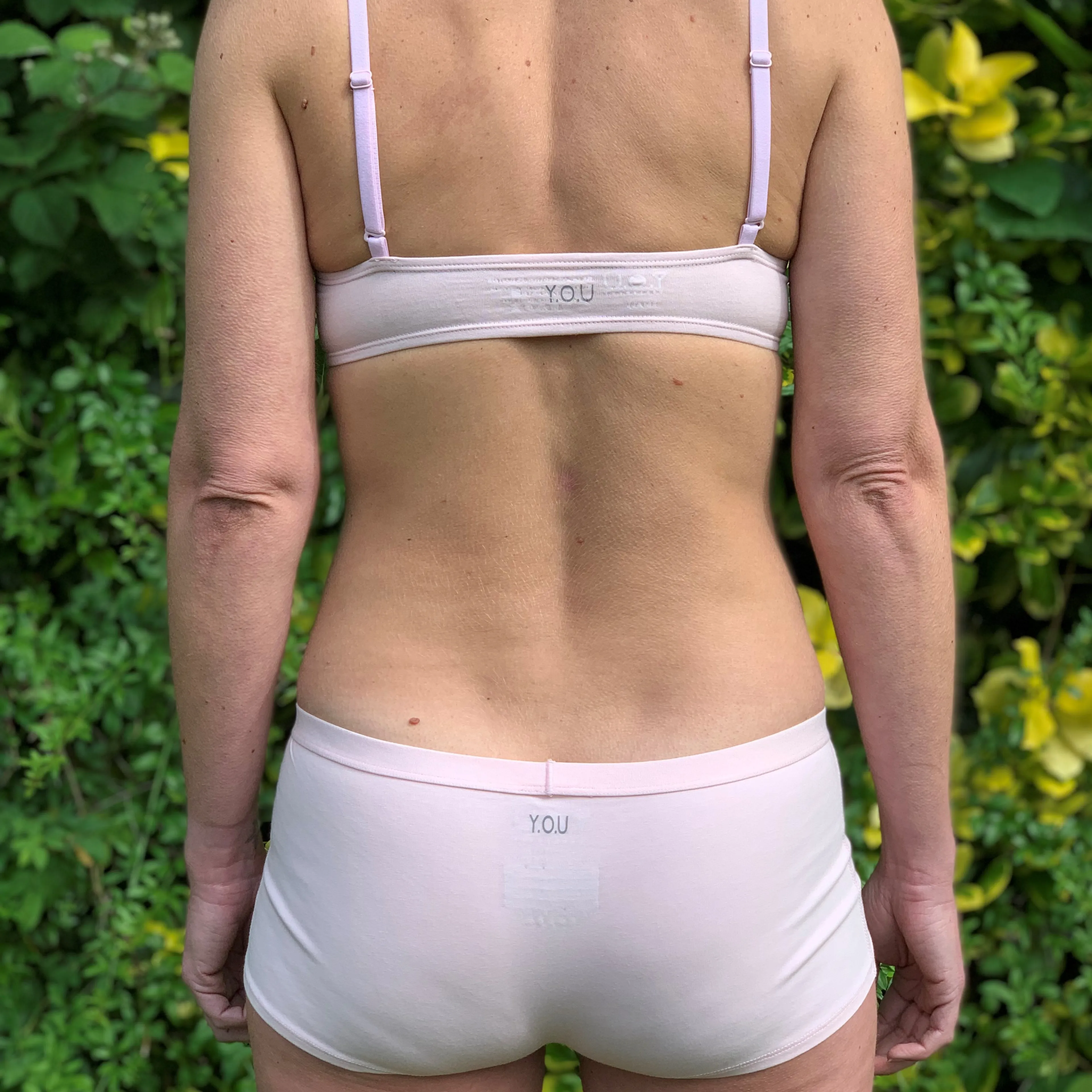 Women's organic cotton matching bralette and boy shorts set in light pink